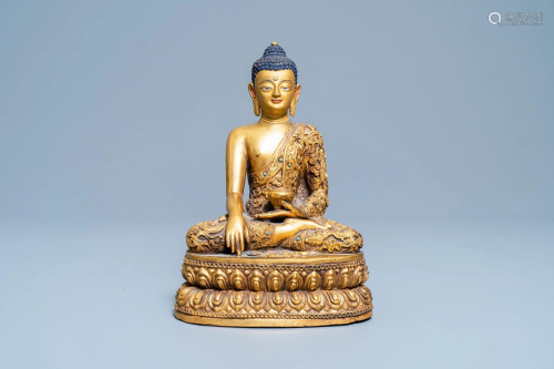 A Chinese turquoise inlaid gilt bronze figure of Buddha