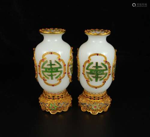 A pair of chinese gilt silver glass bottles