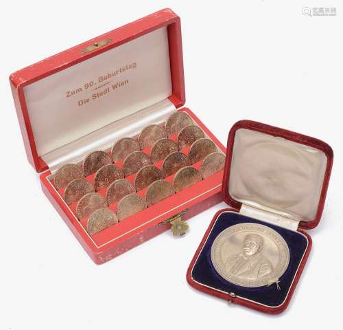 An Austrian cased set of 25 schilling coins and a cased .950...