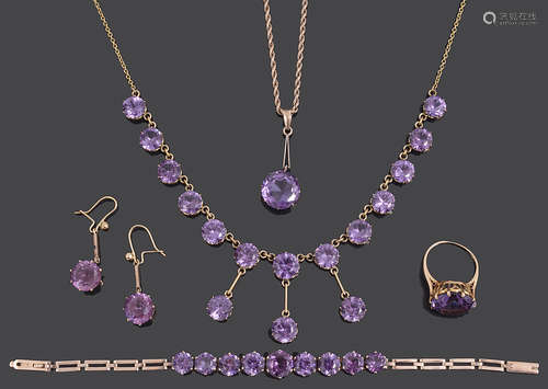 An Edwardian amethyst set drop necklace and a matched suite ...