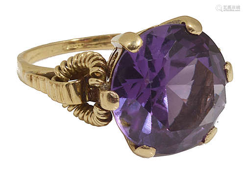 A large Continental purple gem set dress ring