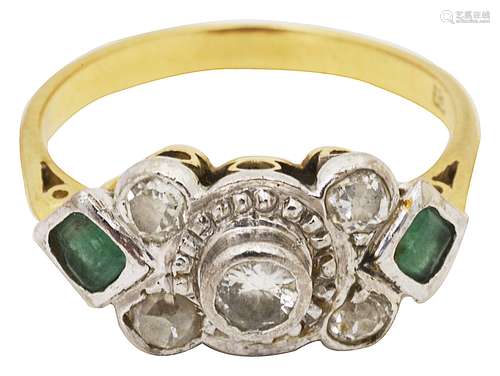 An emerald and diamond ring