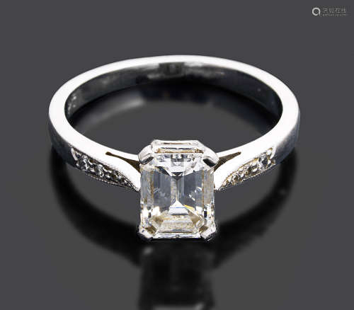 A single stone emerald cut diamond set ring