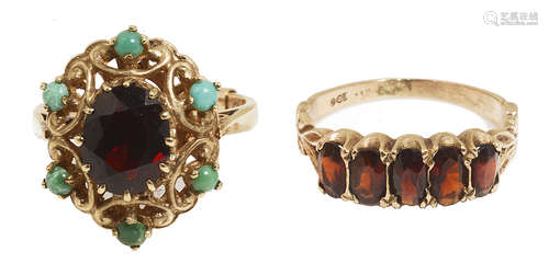 Two 9ct gold mounted garnet set dress rings