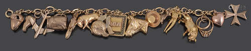 A yellow metal gold charm bracelet