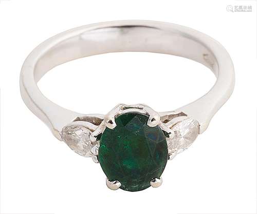 A Continental emerald and diamond three stone ring