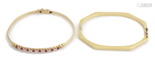 A delicate ruby and diamond set bangle and another bangle