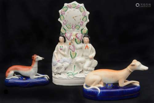 Two 19th c. Staffordshire recumbent greyhound pen stands and...