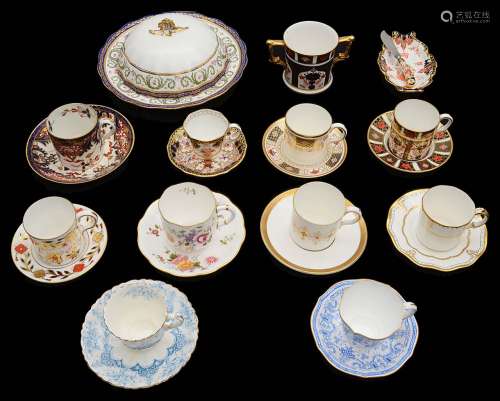 A collection of Royal Crown Derby coffee cups and saucers to...