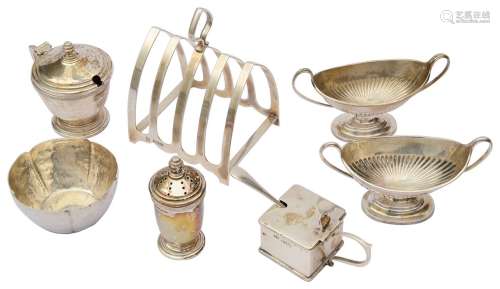 A George VI silver arched four division toast rack; others