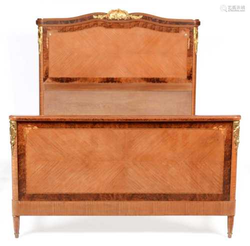 Louis XVI style inlaid mahogany and amboyna double bed.