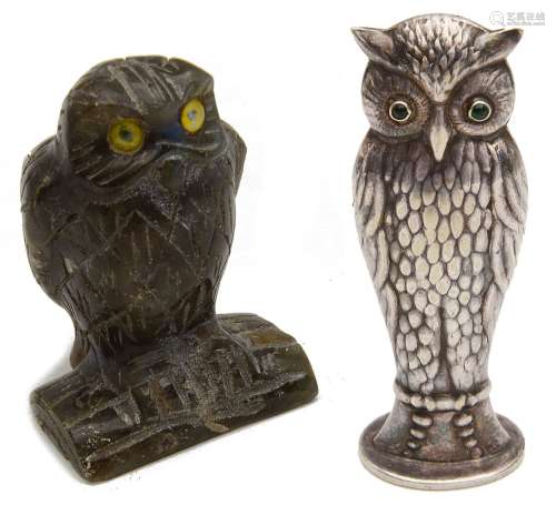 A labradorite carving of an owl perched on log and a contine...