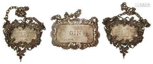 A pair of modern silver decanter labels and another
