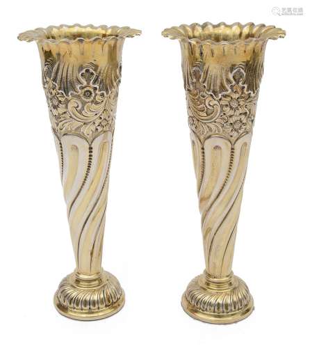 A pair of Edwardian silver-gilt spill vases