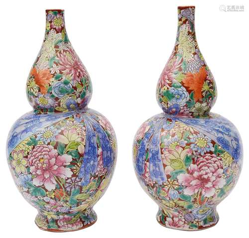 A pair of Chinese famille rose millefleur double gourd vases