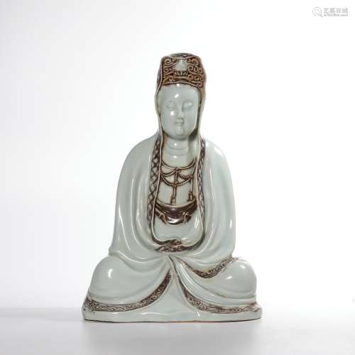 A celadon-glazed statue of Guanyin