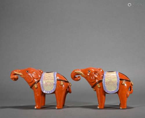 A pair of red glazed elephant