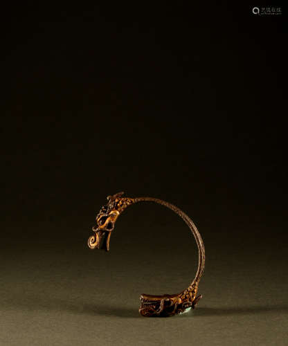 13th century - Iron and gold dragon head bracelet