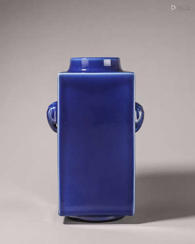 A deep blue glazed porcelain cong with elephant head shaped ...