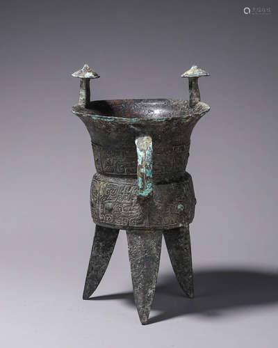 A taotie patterned three-legged bronze pot