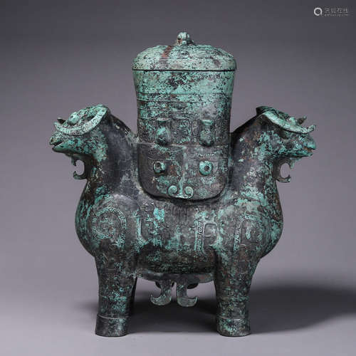 A taotie patterned bronze goat zun