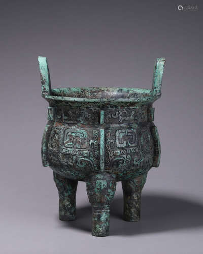 A taotie patterned double-eared bronze pot