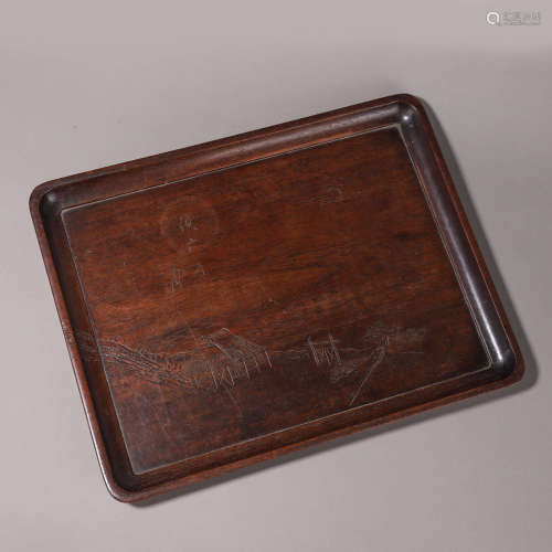 A patterned rosewood tea tray