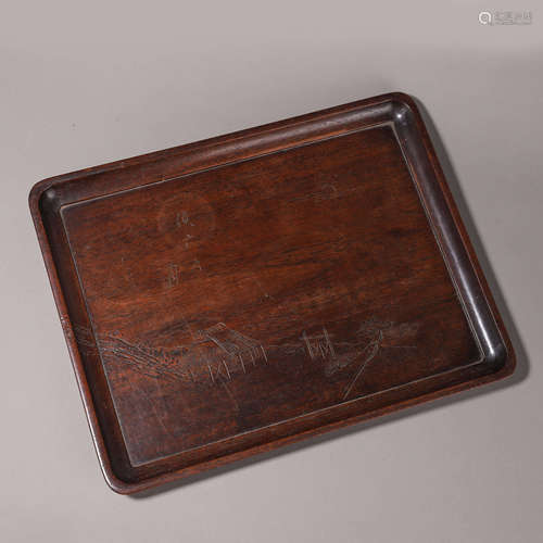 A patterned rosewood tea tray