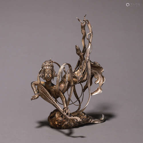 A silver figure ornament