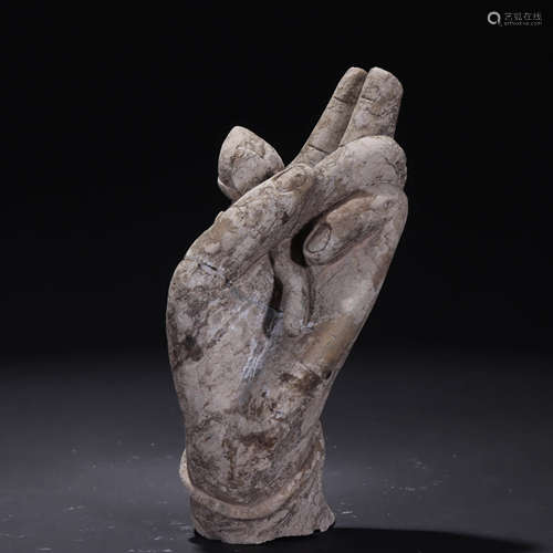 A stone carved buddha hand ornament