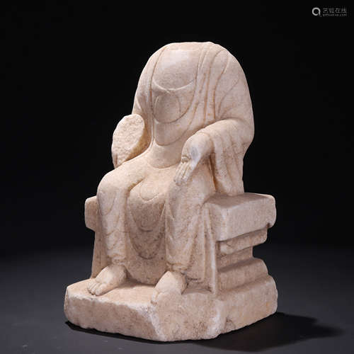 A white jade carved buddha statue