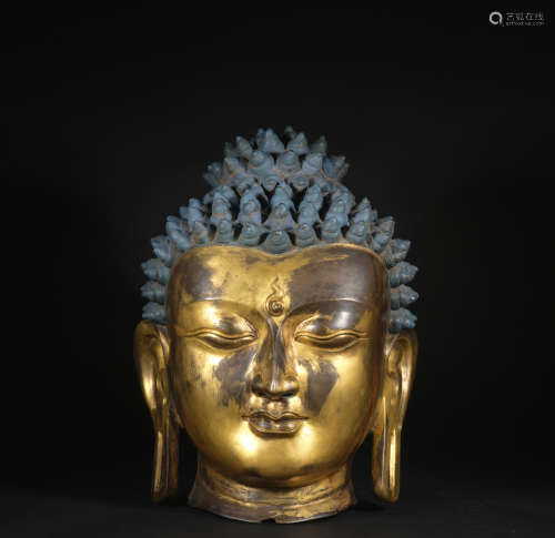 A gilt-bronze buddha head