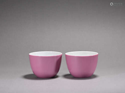 A pair of Carmine glazed cup
