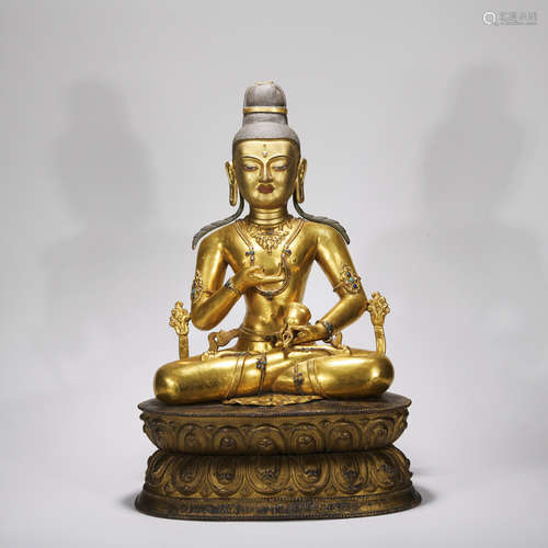 A gilt-bronze statue of Vajrasa hammer