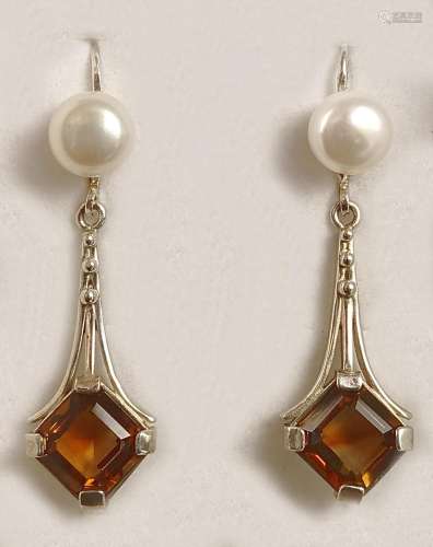 Pair of art deco earrings, hinged earwire set with genuine w...