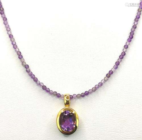 Amethyst gold necklace, pendant set with a genuine oval face...
