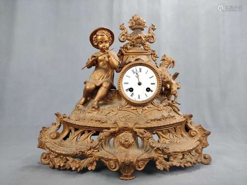 Table clock/chimney clock with boy playing the flute, goat t...