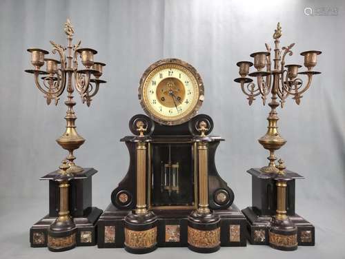 A large mantel clock/Pendule, with two four-armed chandelier...