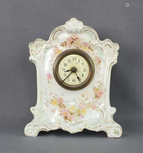 Table clock, porcelain body, probably France, h 21.5cm, star...