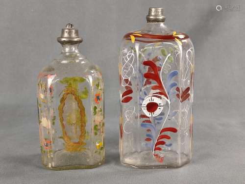 Two schnapps bottles, of mouth blown glass with polychrome e...