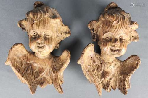 Two angel heads, laughing chubby faces, wood, 19th century, ...