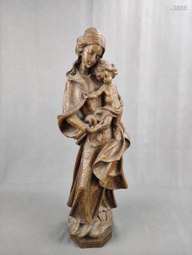Madonna with infant Jesus, sweetly leaning towards her, on o...