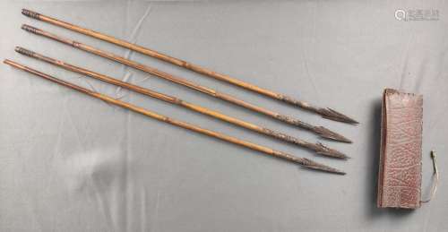 Four arrows with leather quiver, barbed iron arrowhead, cane...