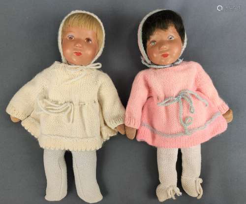 Two small dolls, cloth body with wire, filled, plastic heads...