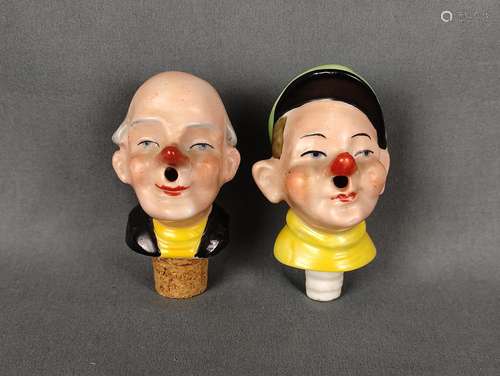 Two wine/brandy pourers, two male heads, polychrome painted,...