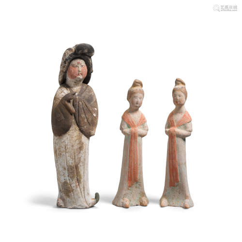A group of three pottery figures
