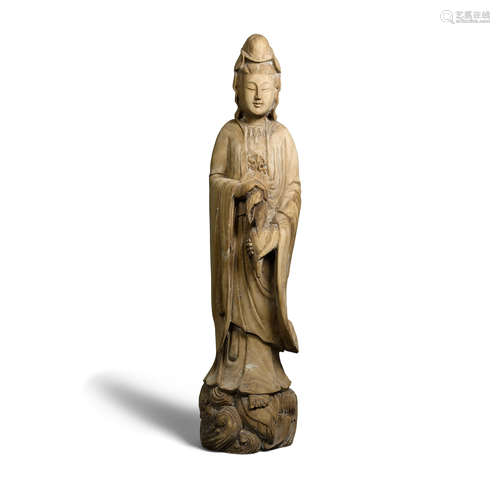 A carved wood figure of guanyin