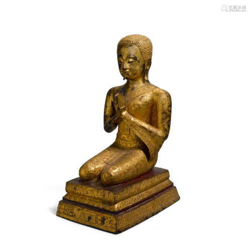 A GILT LACQUER COPPER ALLOY FIGURE OF AN ARHAT
