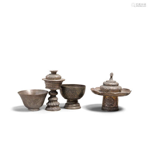 Four silver repoussé ritual containers