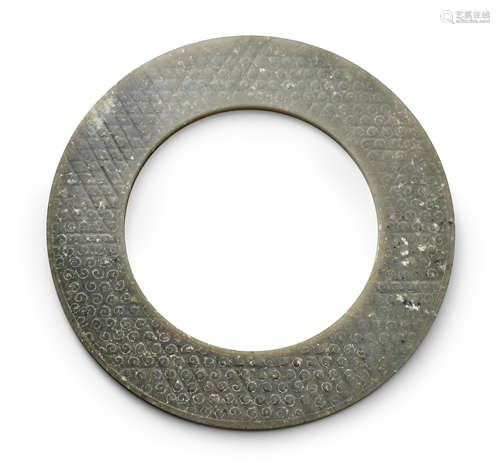 An olive-green nephrite jade disc, yuan